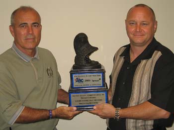 Ranger Central Safety Director Rick Boardman and Project Manager Greg Reilly show off an Associated Builders & Contractors award the division received for site development work for Wal-Mart’s Regional Distribution Center in Ft. Pierce, FL, as featured in previous issues.