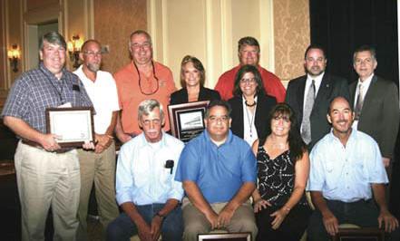 Celebrating Rangers second Best In Construction award in four years from the Florida Transportation Builders Association  this time for work on SR-414 in Orange County  are project team members, the engineering consultant, and state and association officials. Seated L-R: Ranger Project Superintendent Charles Geiger, Project Manager Scott Fowler and Scheduling Engineer Lisa Jones; and Scott Leware of Leware Construction. Standing L-R: Ricky Langley of DRMP (CEI); Ranger Foreman Scott Dickson and Area Manager Pete Scholer; FTBA President Bonnie Rimmel; FDOT Secretary Stephanie C. Kopelousos; Orlando-Orange County Expressway Authoritys Ben Dreiling; FHWA Division Administrator Martin C. Knopp; and FDOT Chief Engineer Brian Blanchard. (Photo provided by FTBA)
