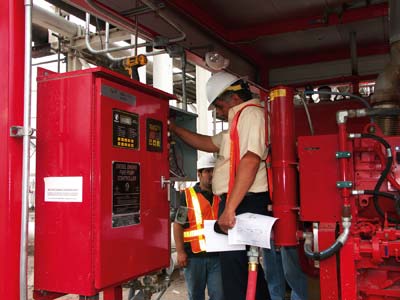 Engineer Jaime Cotero inspects system wiring.